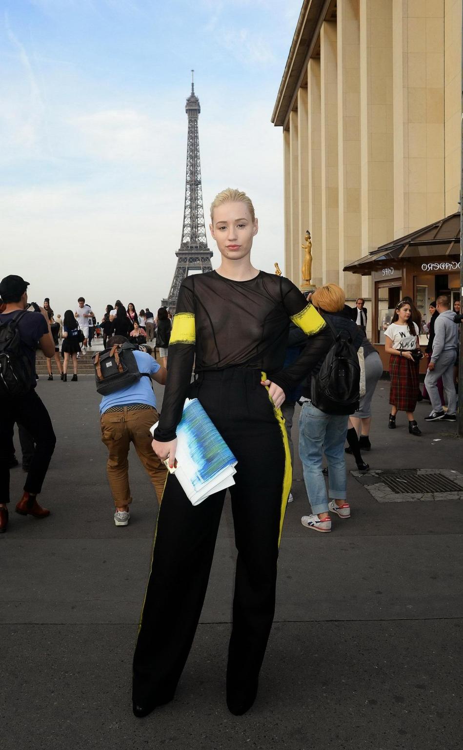 16P Iggy Azalea shows off her tits wearing a see through top at the Maison Martin Ma