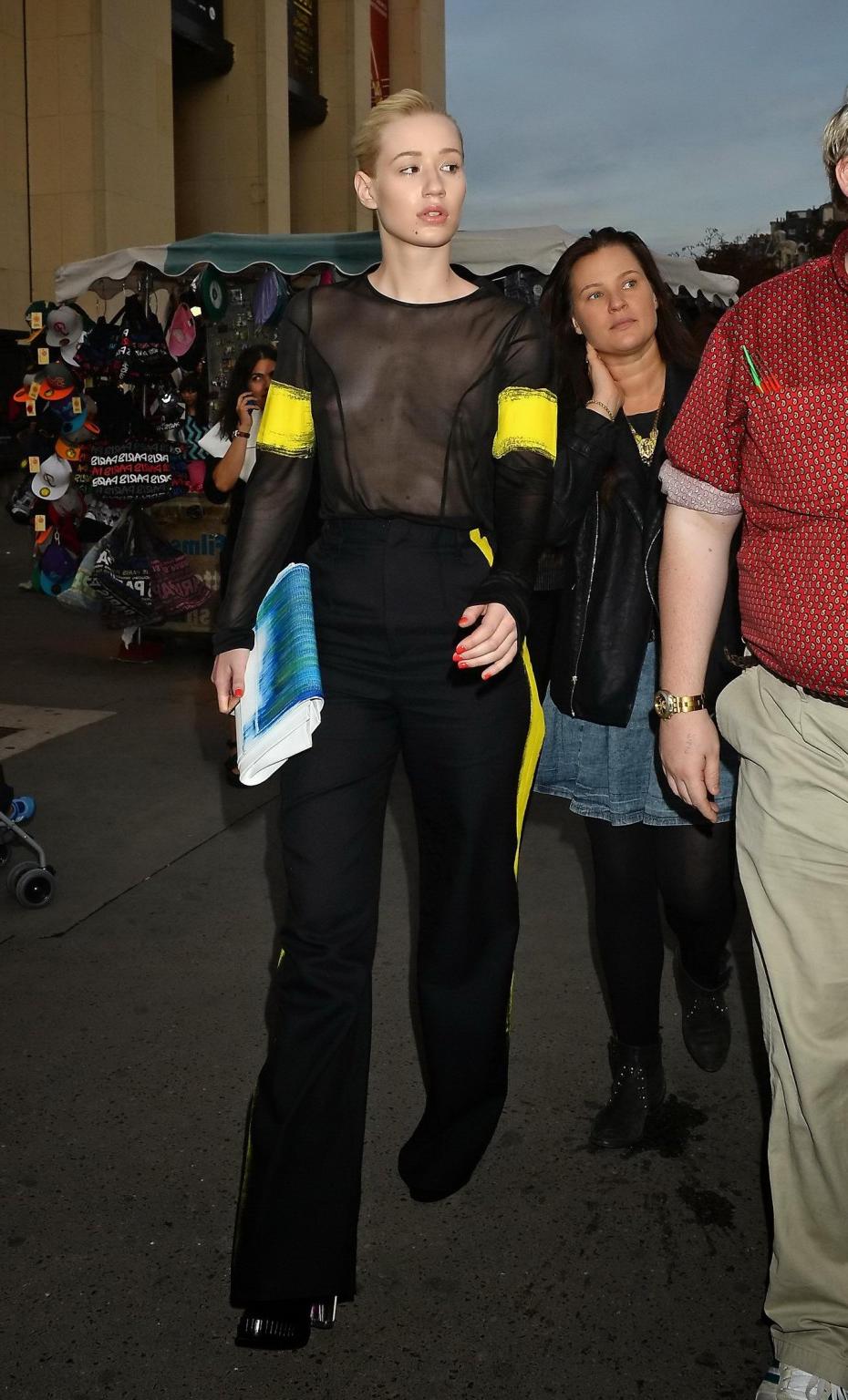 16P Iggy Azalea shows off her tits wearing a see through top at the Maison Martin Ma