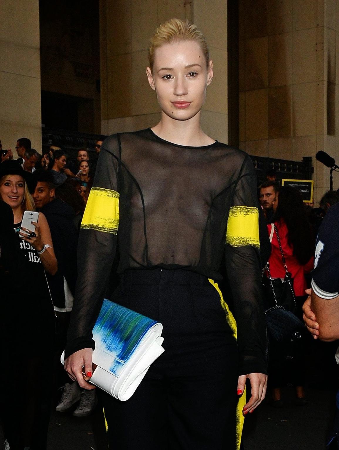 16P Iggy Azalea shows off her tits wearing a see through top at the Maison Martin Ma