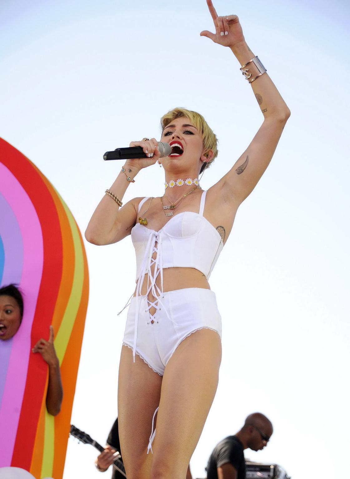 16P Miley Cyrus showing off her hot body in a tiny white outfit at iHeart Radio Musi