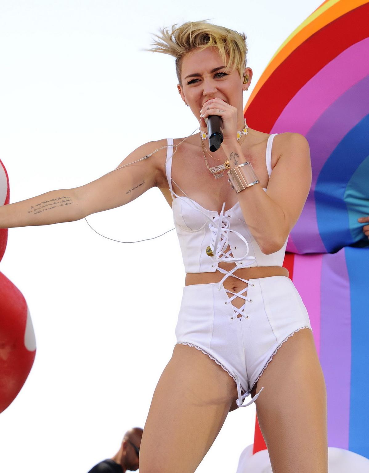16P Miley Cyrus showing off her hot body in a tiny white outfit at iHeart Radio Musi