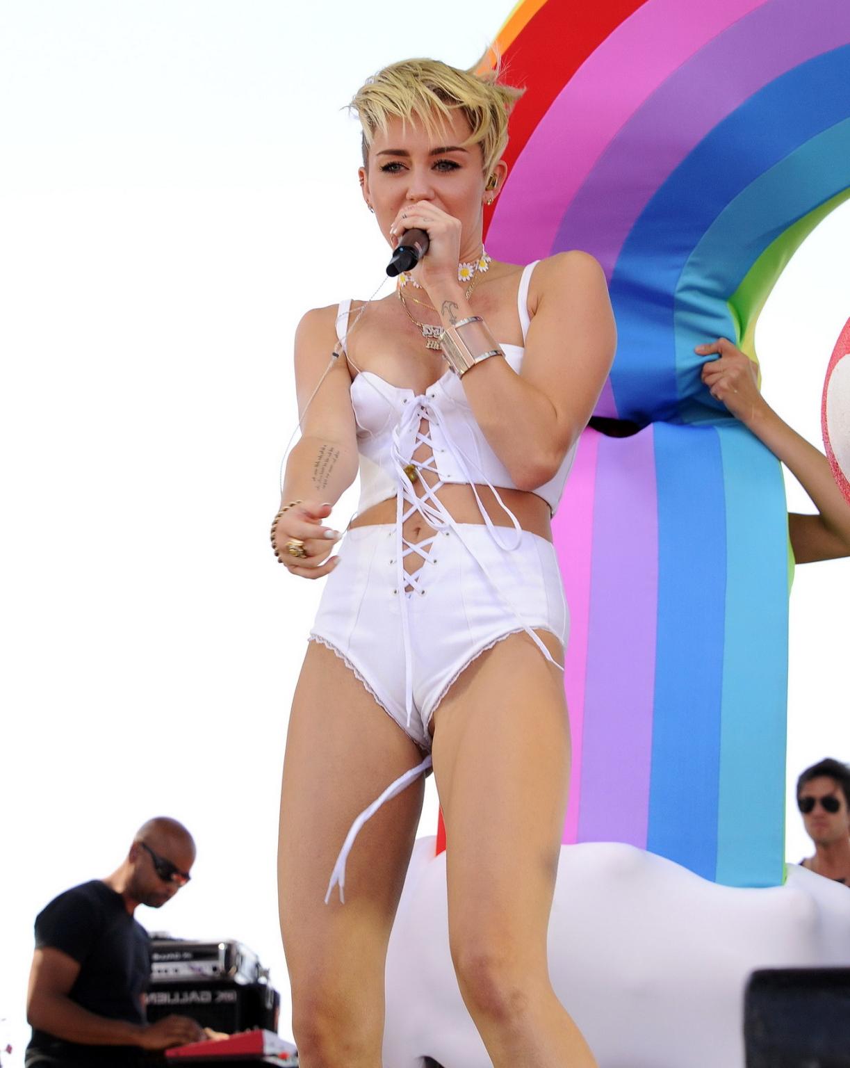 16P Miley Cyrus showing off her hot body in a tiny white outfit at iHeart Radio Musi