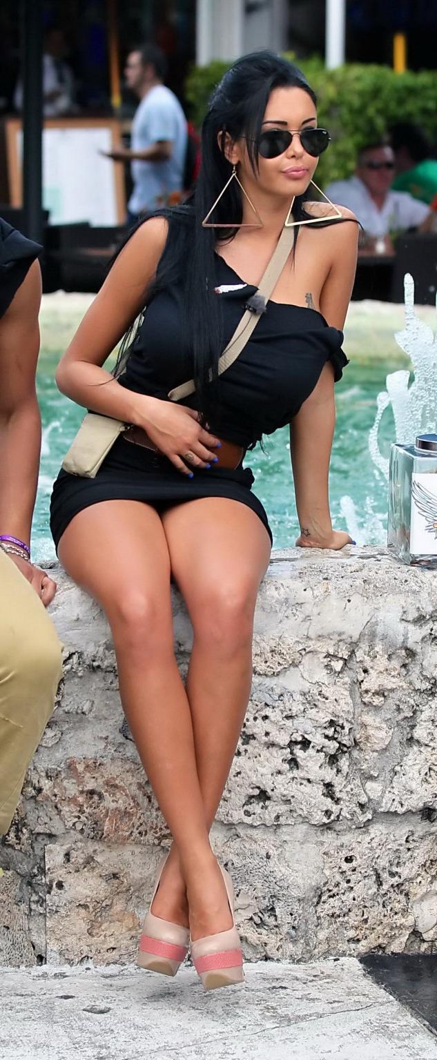 16P Nabilla Benattia slips out of her skimpy black outfit at the press conference in