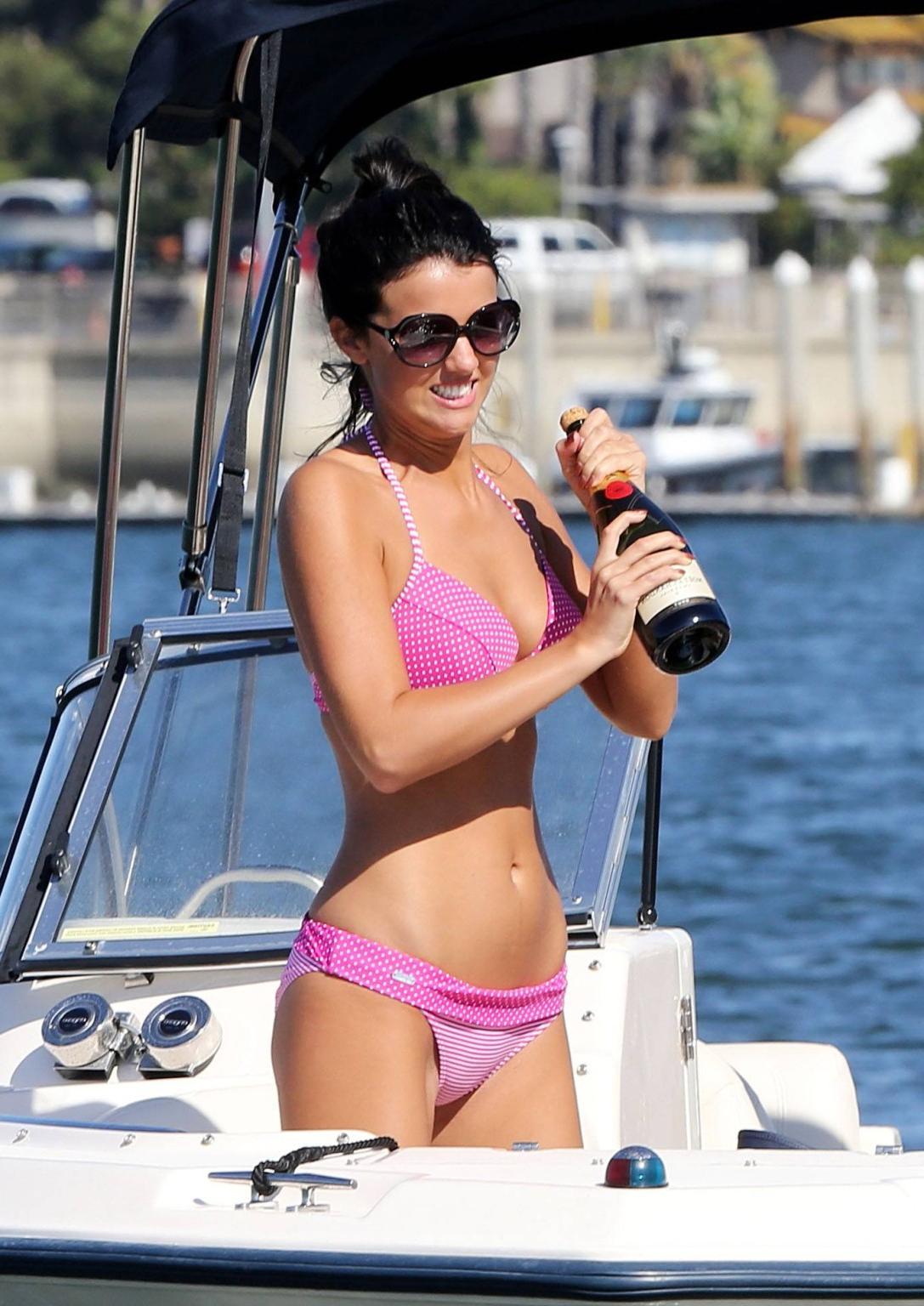 16P Lucy Mecklenburgh wearing pink polka dot bikini fights with a bottle of Moet at 