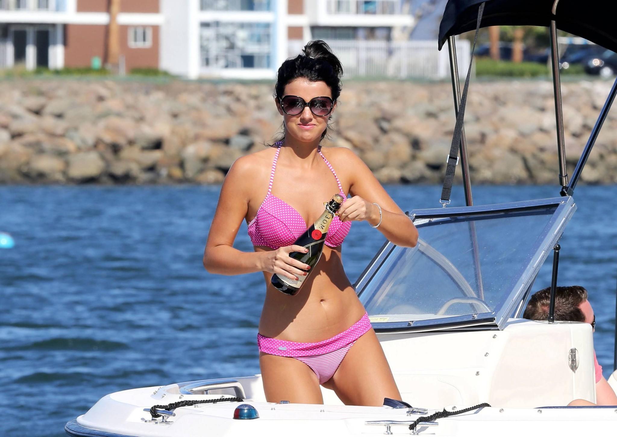 16P Lucy Mecklenburgh wearing pink polka dot bikini fights with a bottle of Moet at 