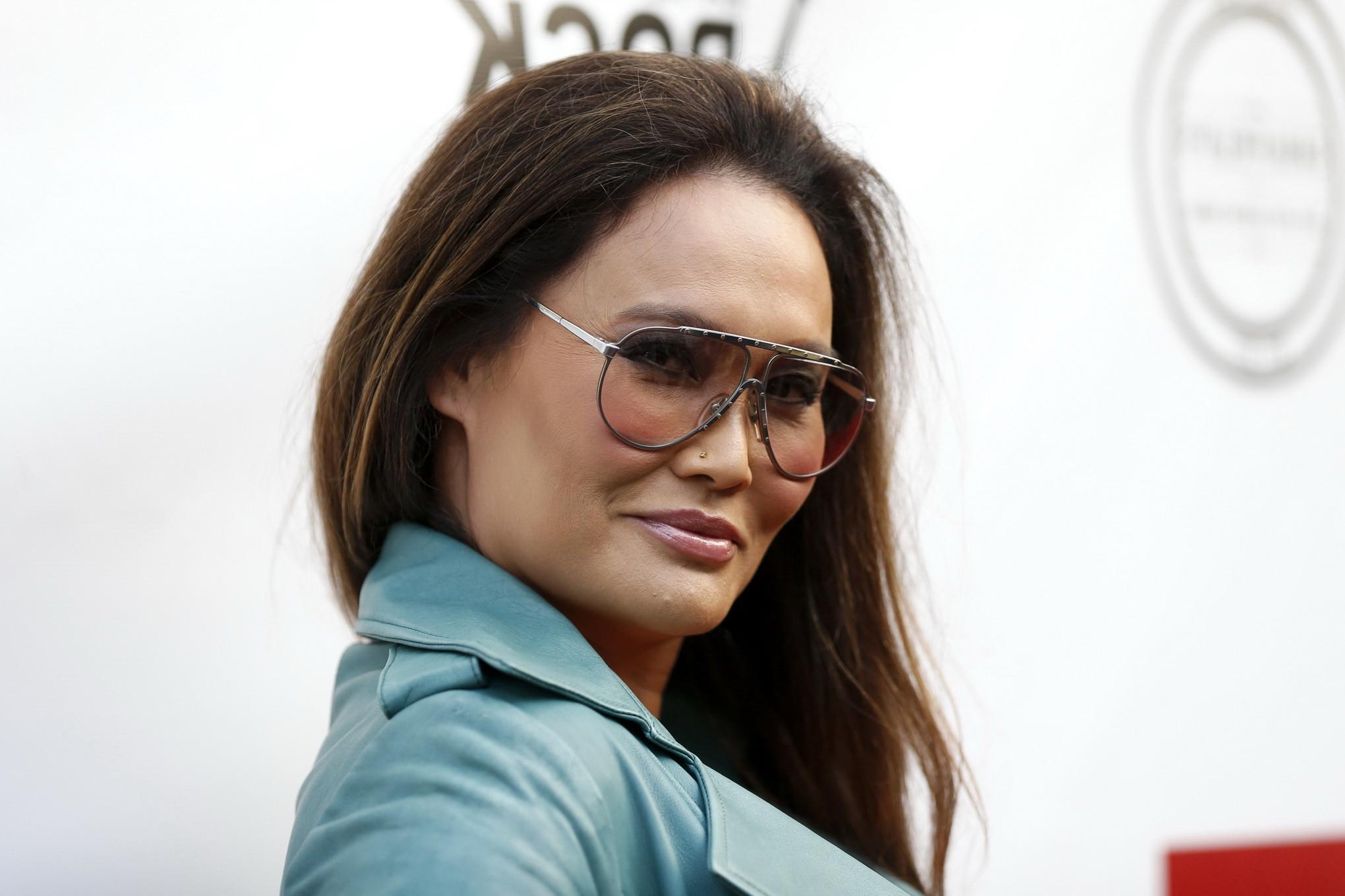 16P Tia Carrere shows huge cleavage wearing a low cut dress at the 'Gutshot Straight