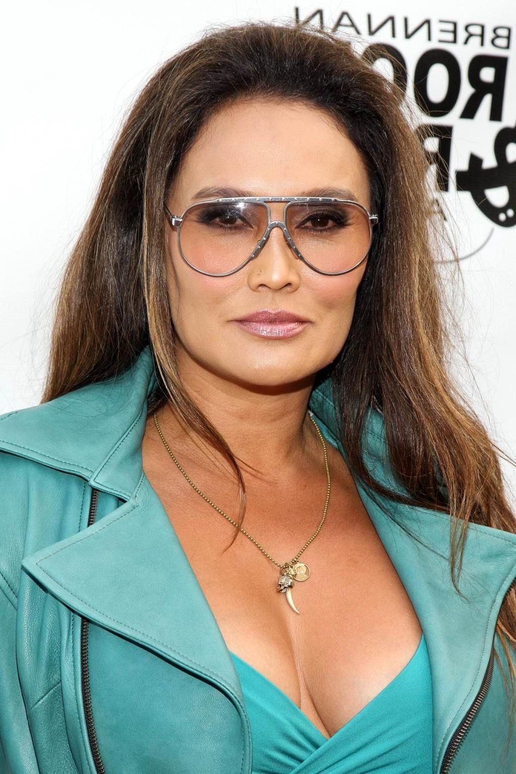 16P Tia Carrere shows huge cleavage wearing a low cut dress at the 'Gutshot Straight