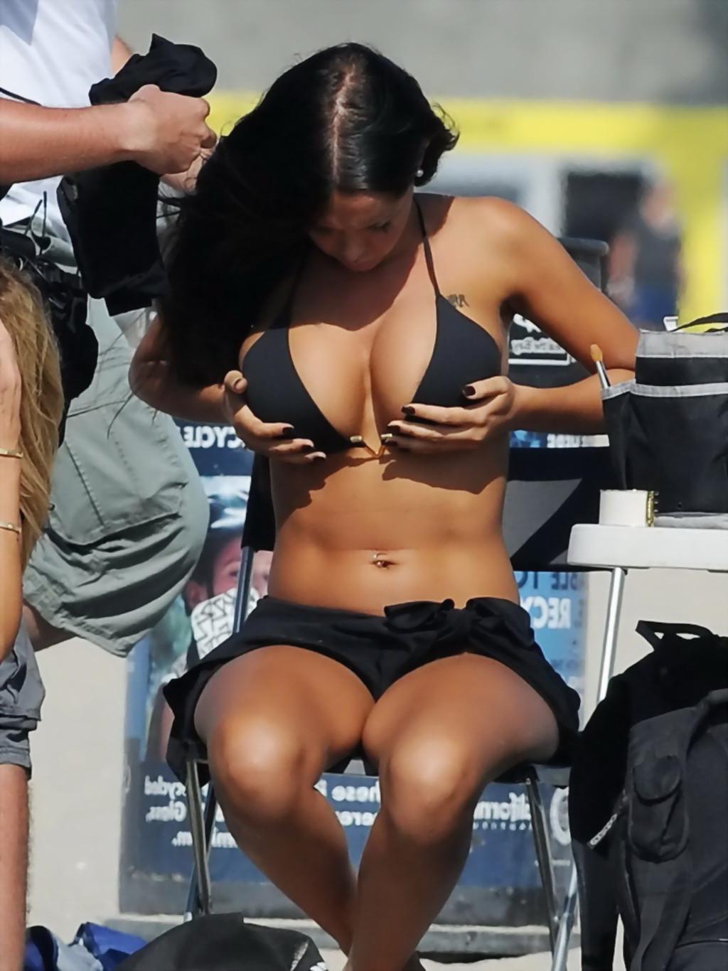 16P Nabilla Benattia slips out of her skimpy black bikini at the beach in Los Angele