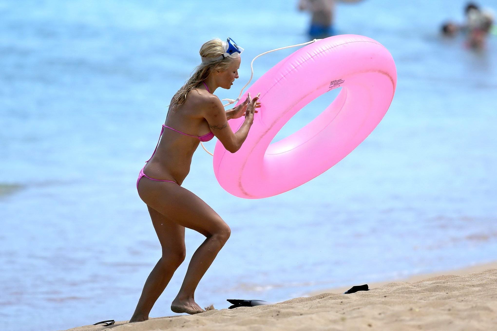 16P Busty Pamela Anderson showing pokies in a wet pink bikini while snorkeling on a 