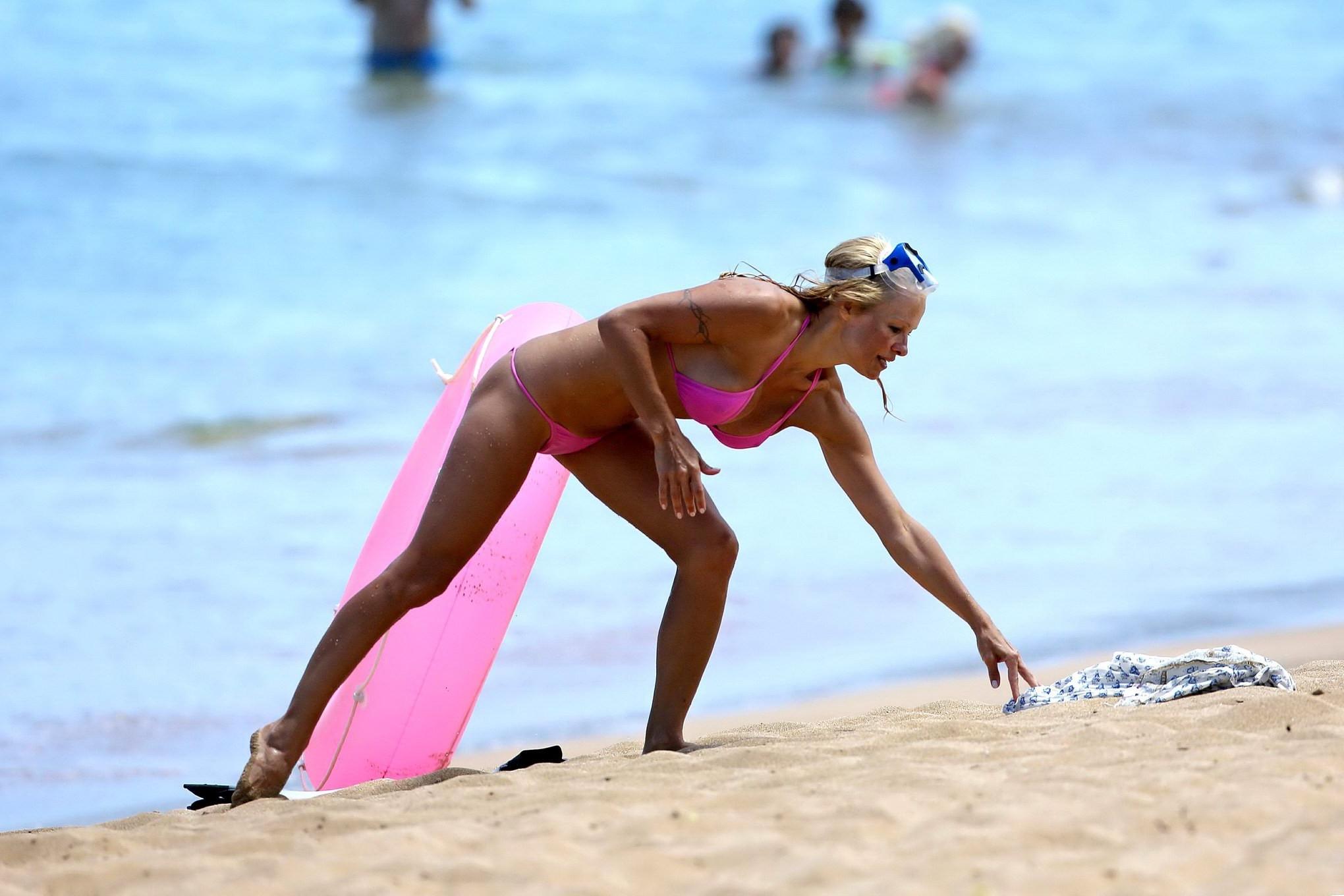 16P Busty Pamela Anderson showing pokies in a wet pink bikini while snorkeling on a 
