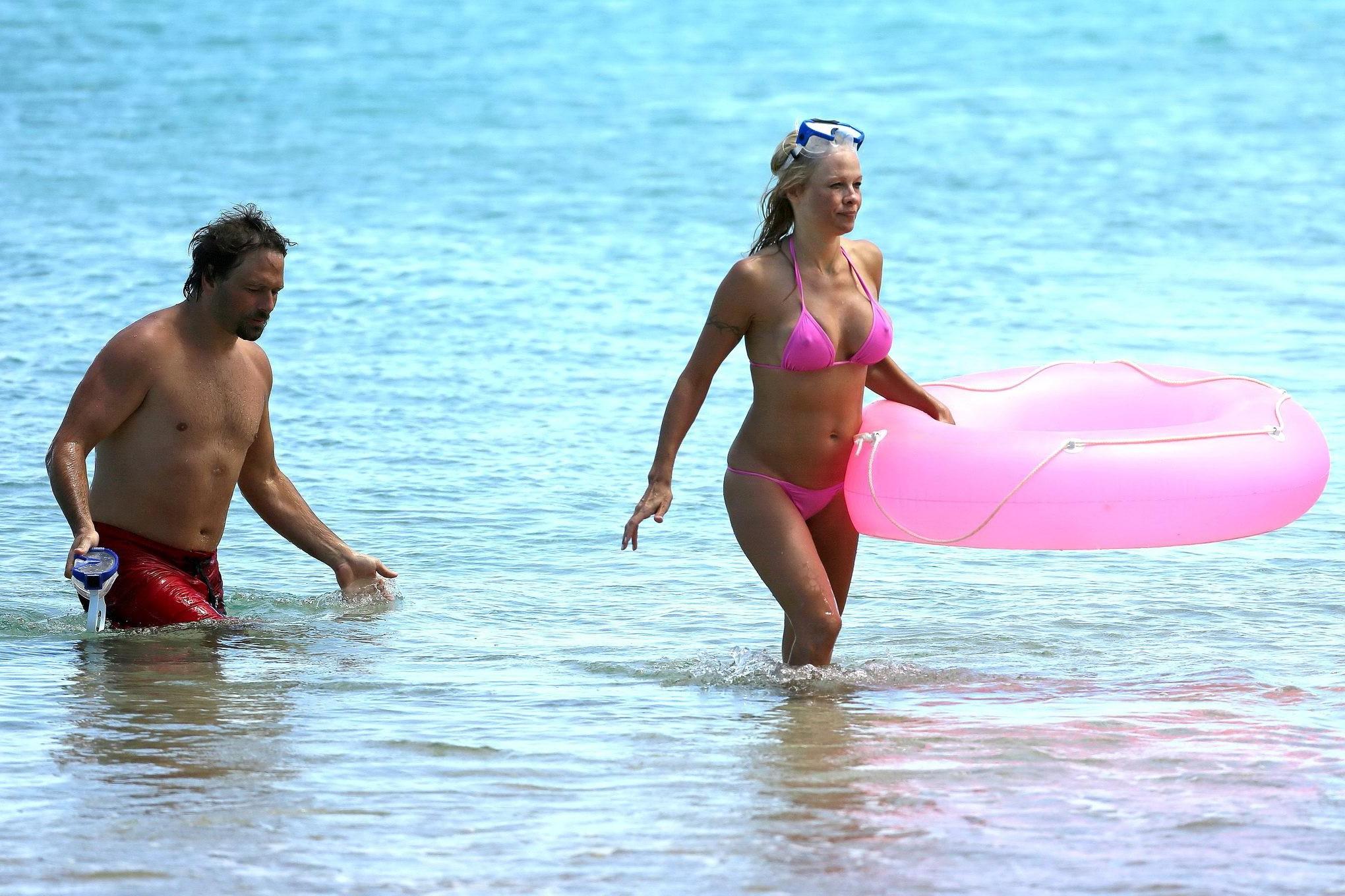 16P Busty Pamela Anderson showing pokies in a wet pink bikini while snorkeling on a 