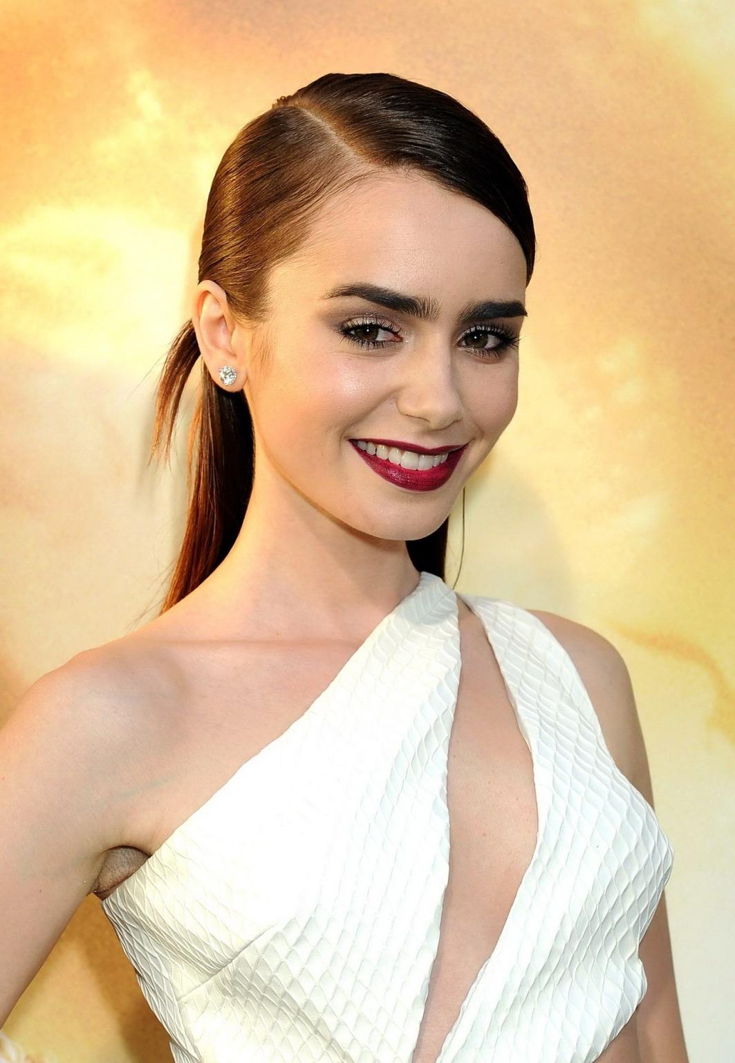 16P Lily Collins showing huge cleavage braless in short white cut-out dress at The M
