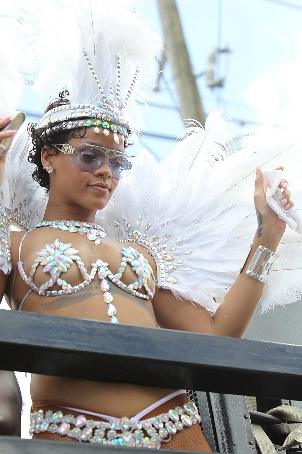 16P Rihanna wearing tiny carnival costume at Kadooment Day Parade in Barbados