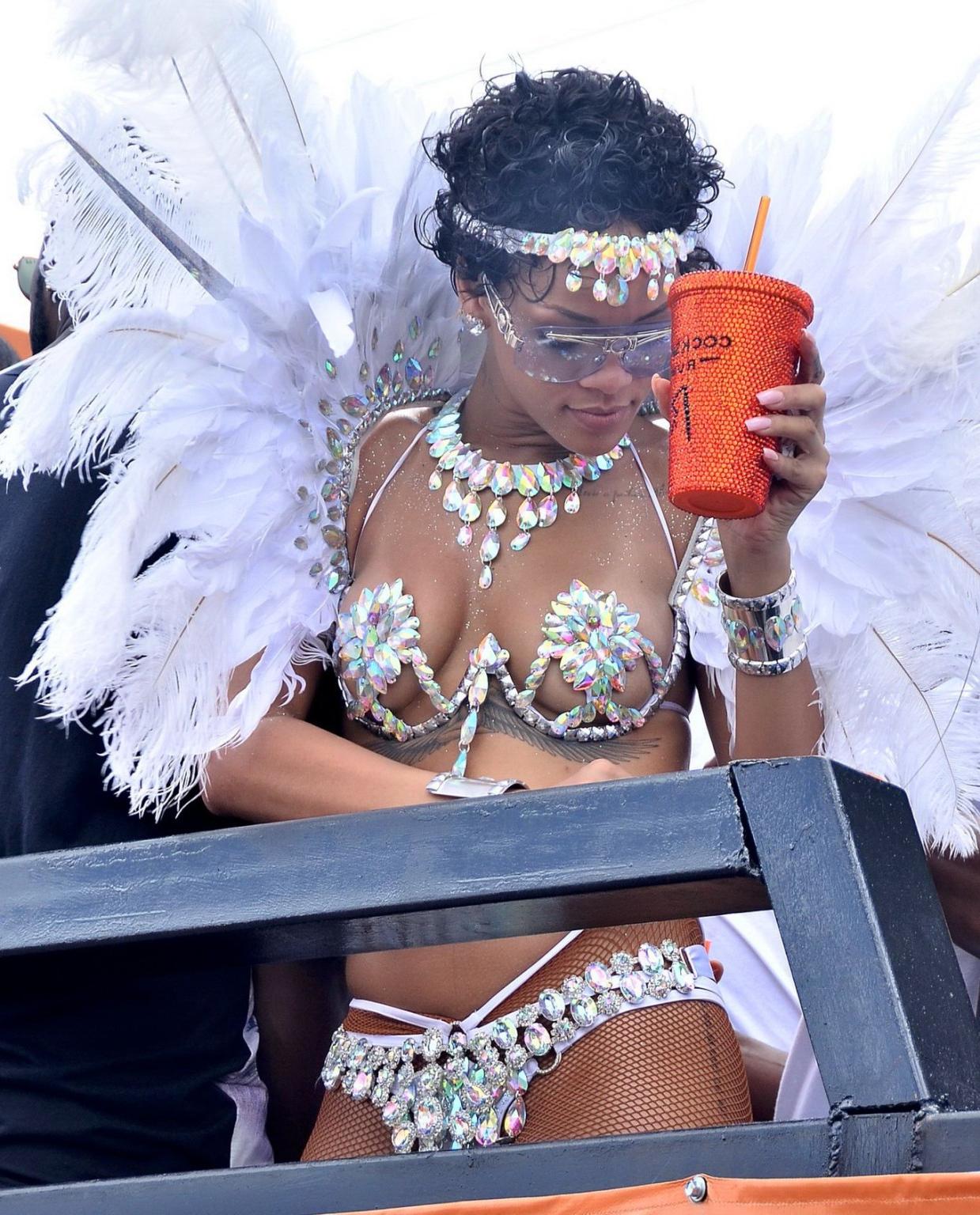16P Rihanna wearing tiny carnival costume at Kadooment Day Parade in Barbados