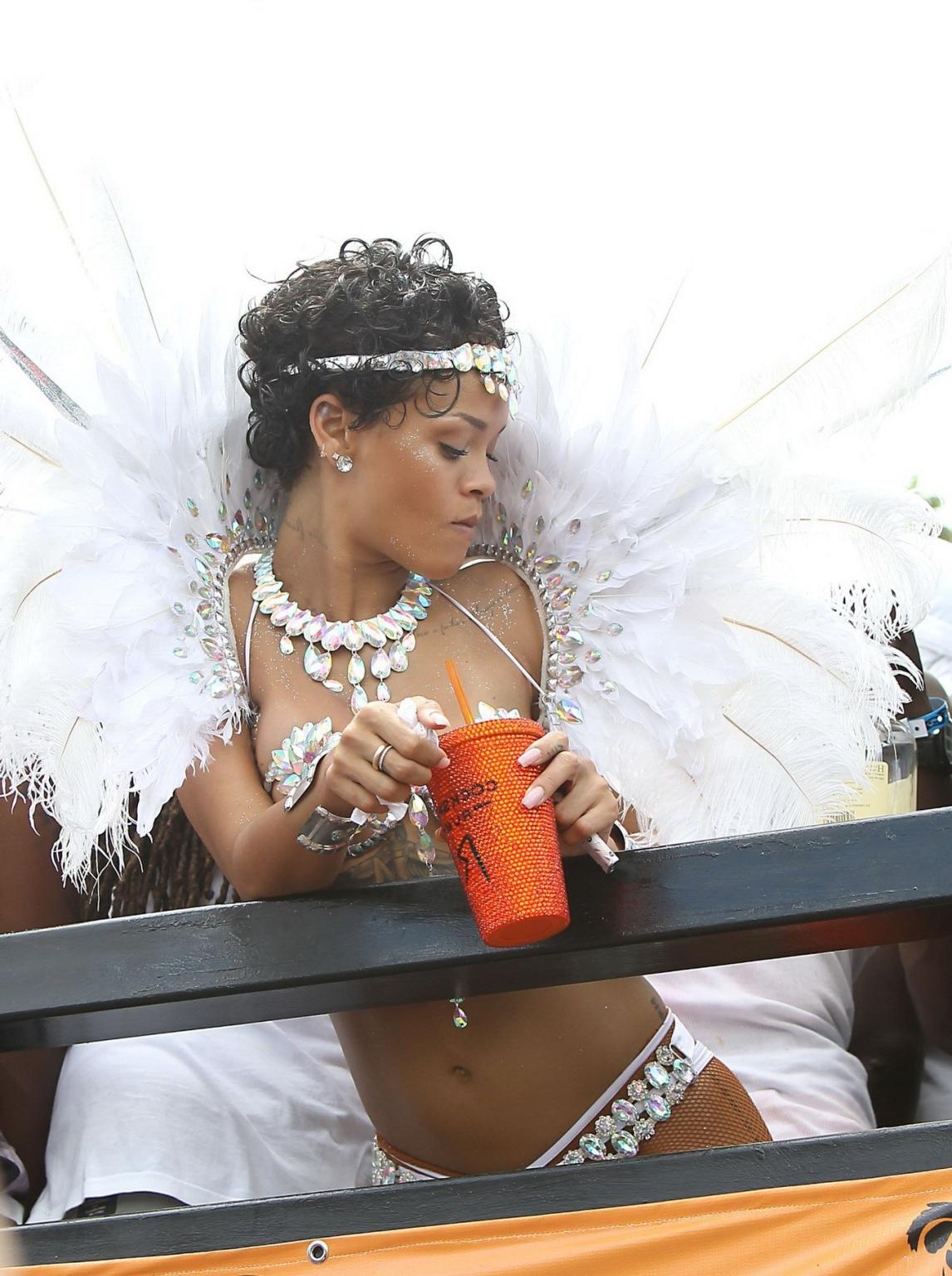 16P Rihanna wearing tiny carnival costume at Kadooment Day Parade in Barbados