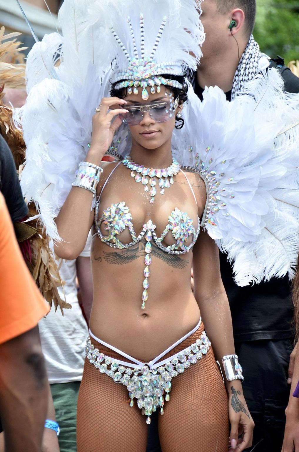 16P Rihanna wearing tiny carnival costume at Kadooment Day Parade in Barbados