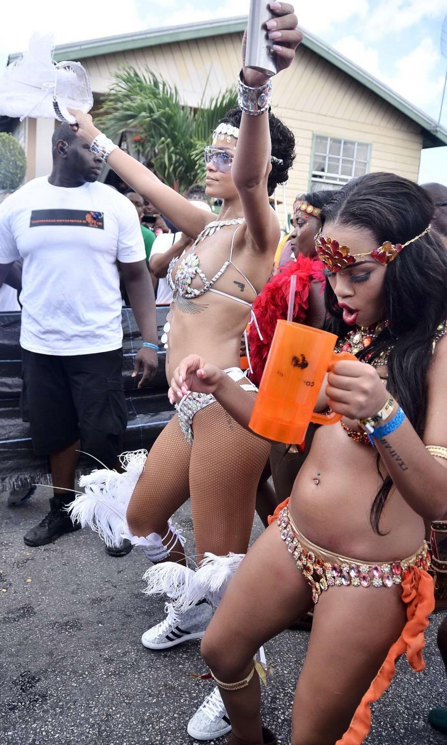16P Rihanna wearing tiny carnival costume at Kadooment Day Parade in Barbados