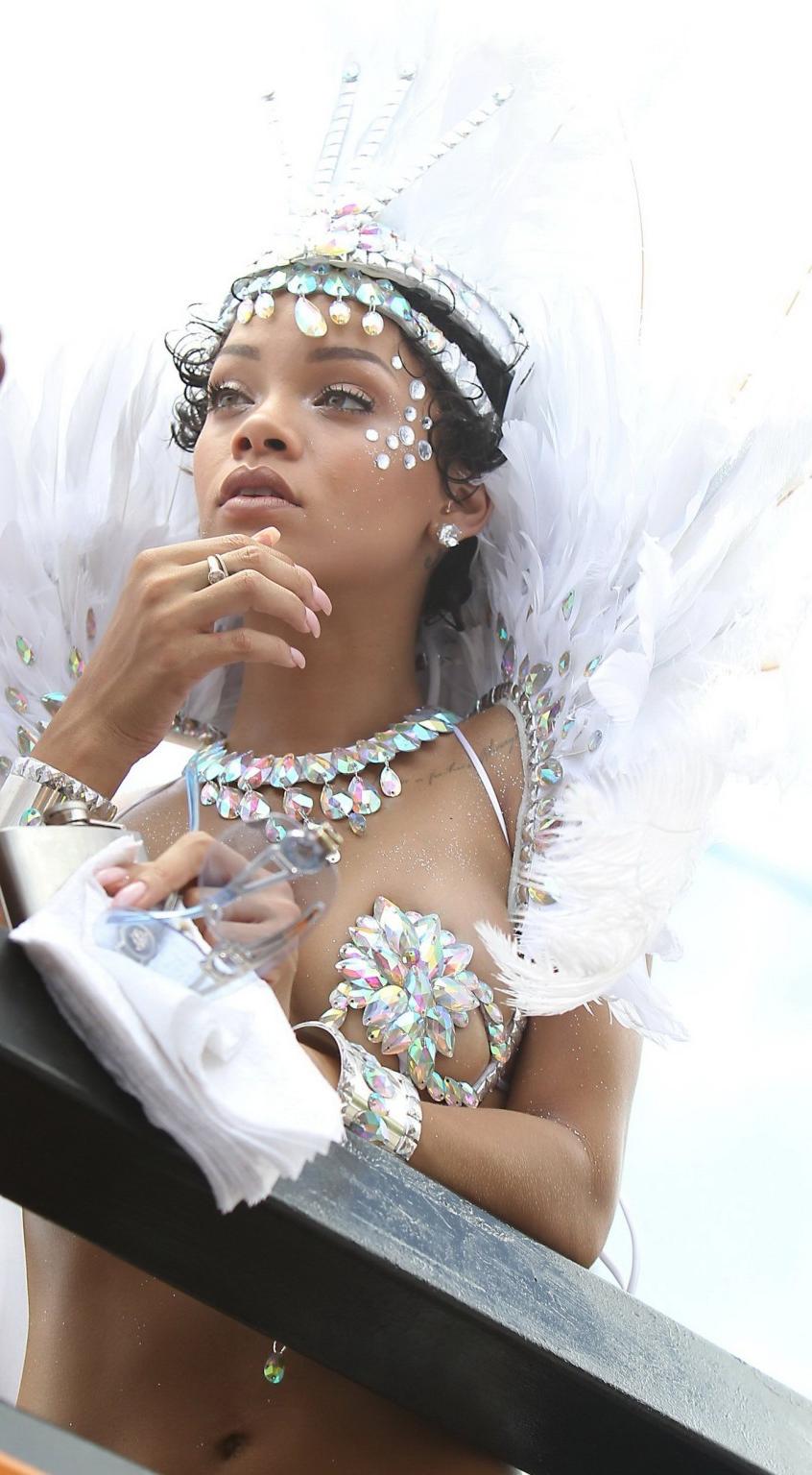 16P Rihanna wearing tiny carnival costume at Kadooment Day Parade in Barbados