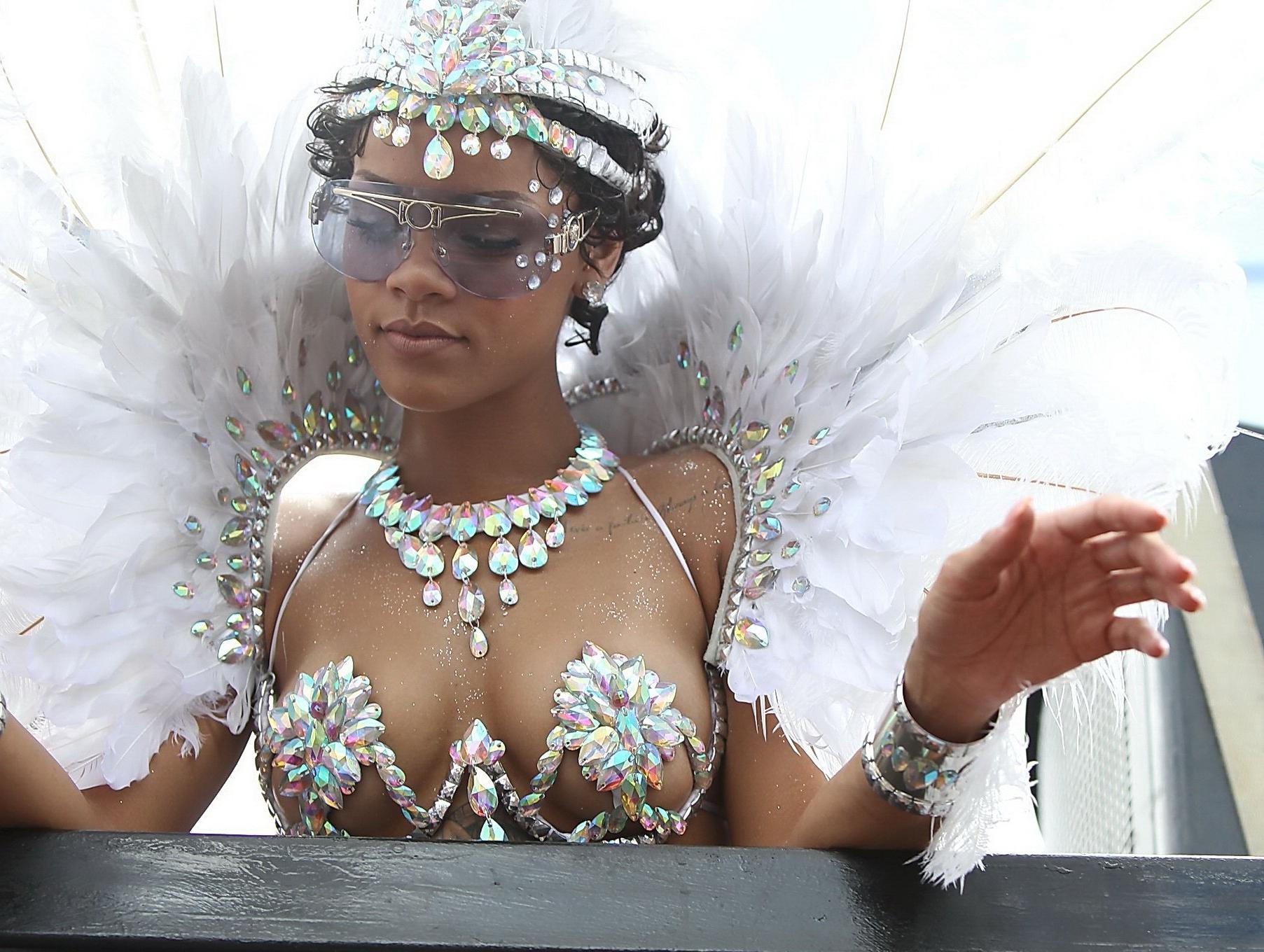 16P Rihanna wearing tiny carnival costume at Kadooment Day Parade in Barbados