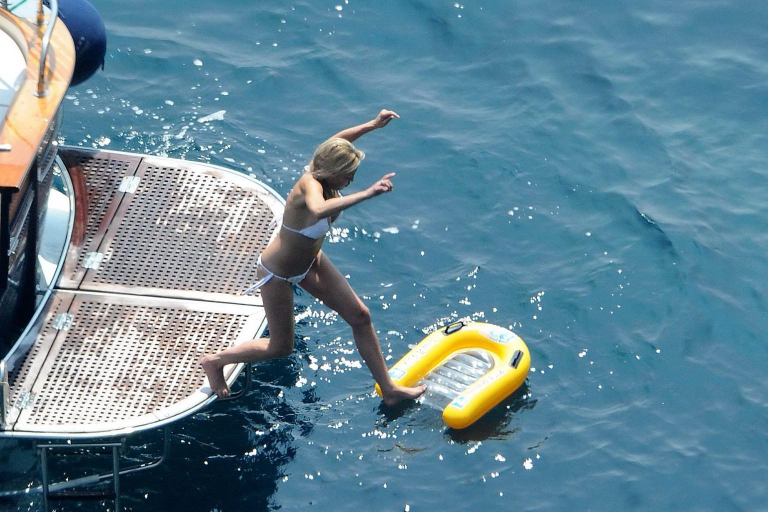 16P Sharon Stone tanning topless  showing ass crack on a yacht in Italy