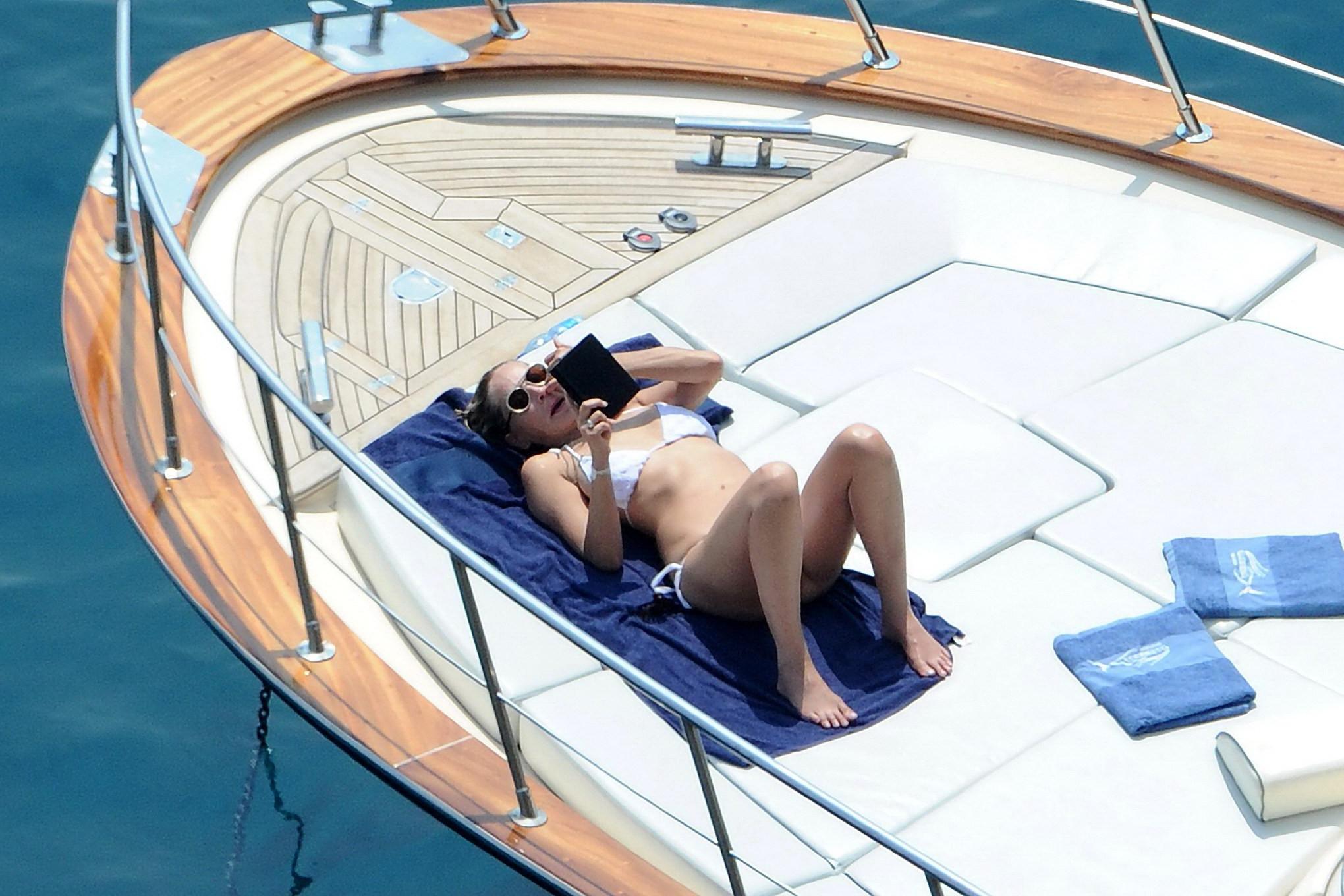 16P Sharon Stone tanning topless  showing ass crack on a yacht in Italy
