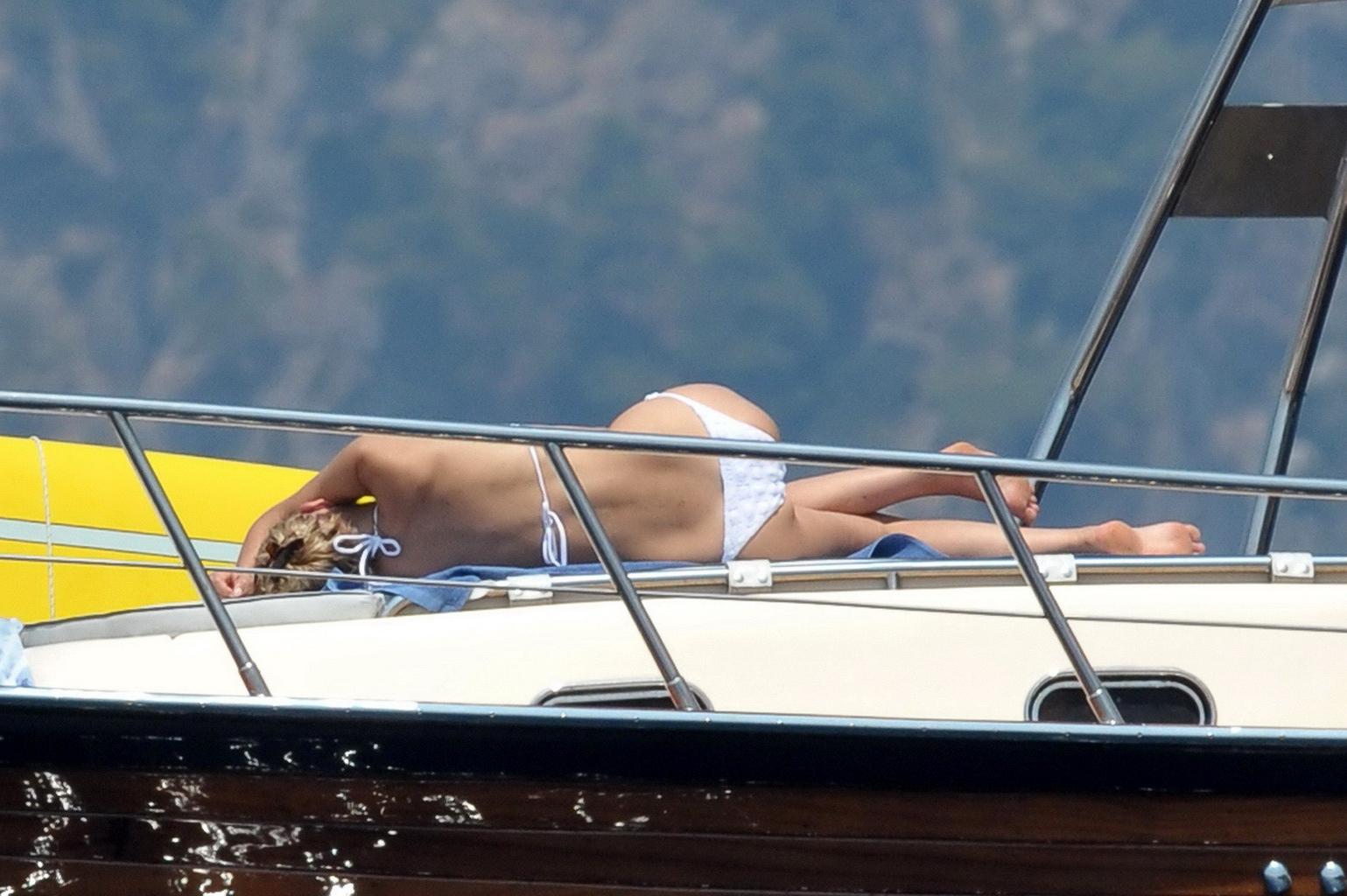 16P Sharon Stone tanning topless  showing ass crack on a yacht in Italy
