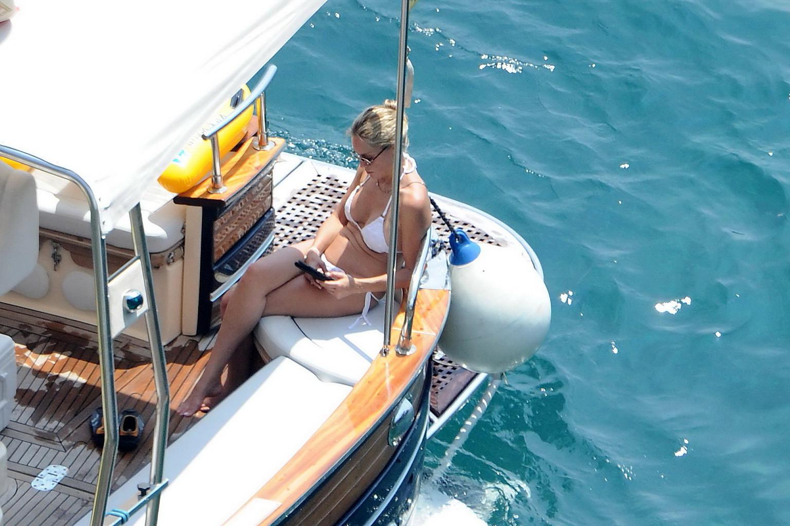 16P Sharon Stone tanning topless  showing ass crack on a yacht in Italy