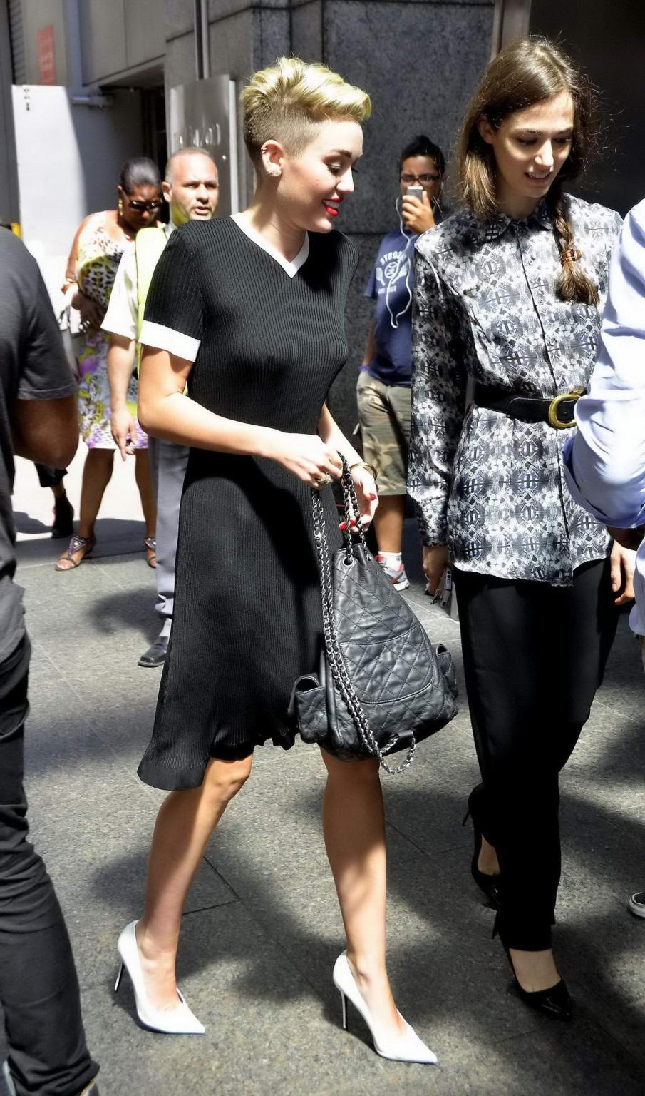 16P Miley Cyrus flashing her boobs braless in black transparent dress out in NYC