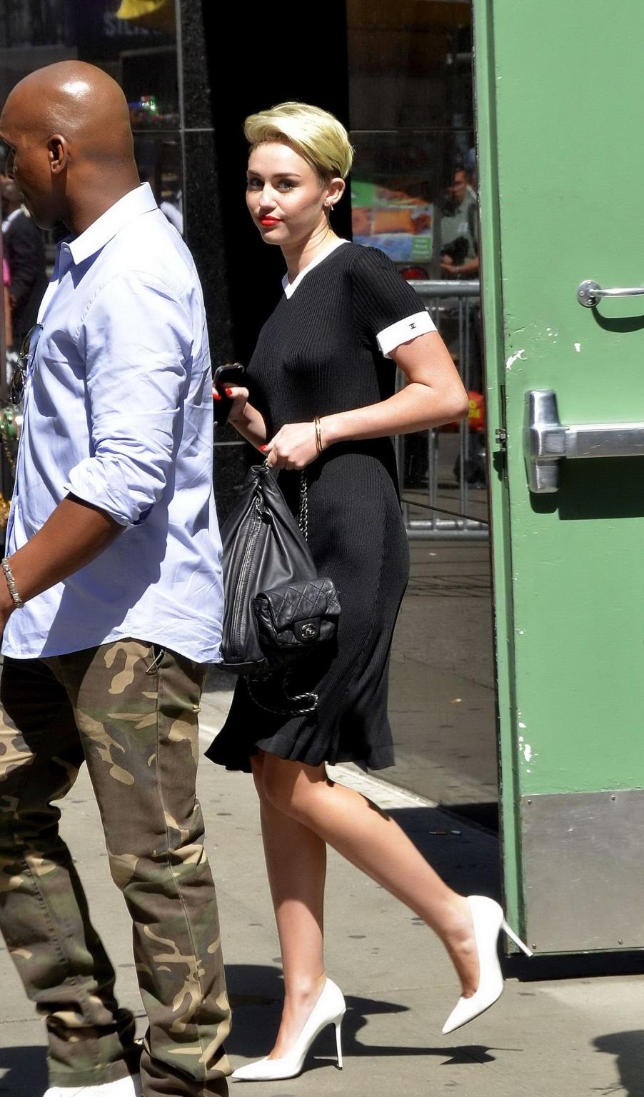 16P Miley Cyrus flashing her boobs braless in black transparent dress out in NYC