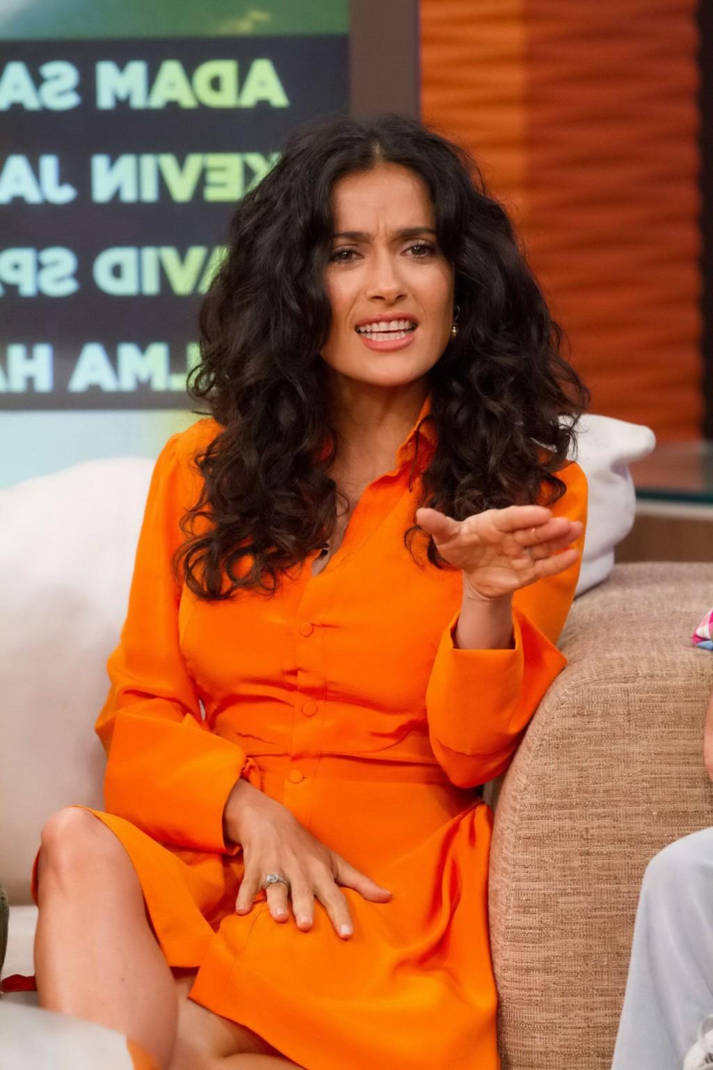 16P Salma Hayek upskirt wearing short orange dress at Despierta America Show in Miam