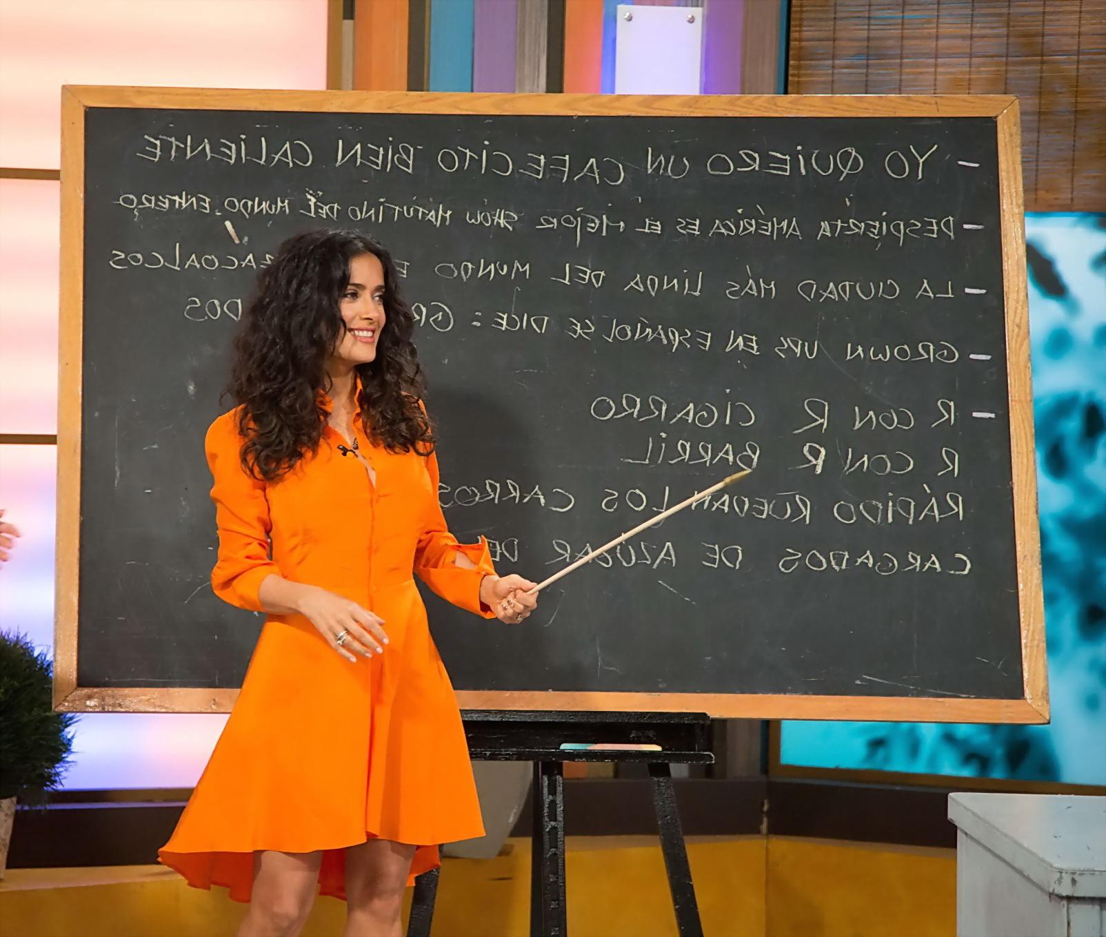 16P Salma Hayek upskirt wearing short orange dress at Despierta America Show in Miam