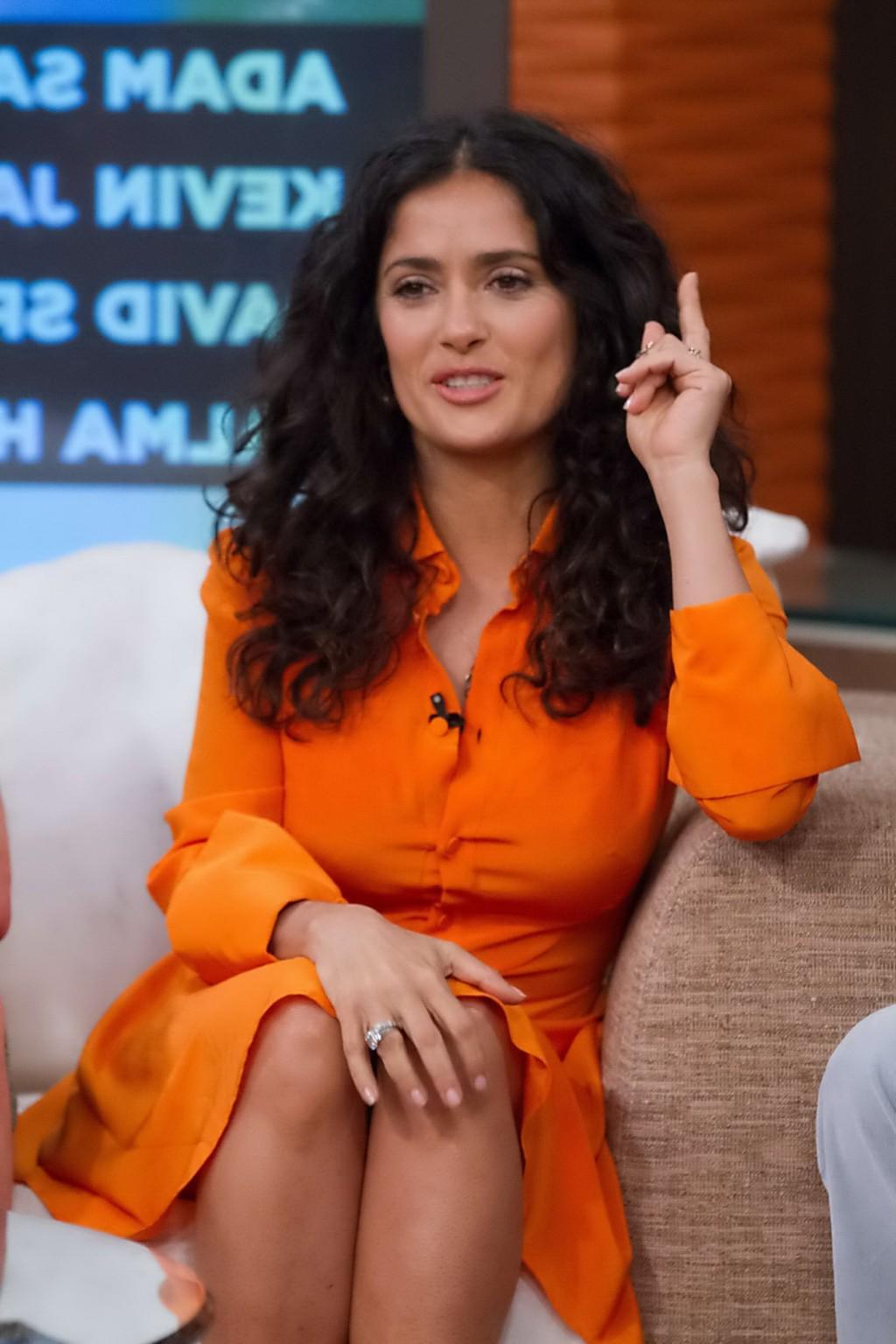 16P Salma Hayek upskirt wearing short orange dress at Despierta America Show in Miam