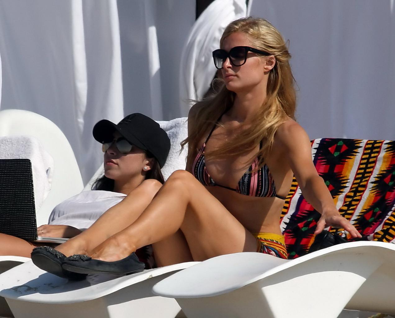 16P Paris Hilton shows off her hot body wearing tiny striped bikini at the beach in 