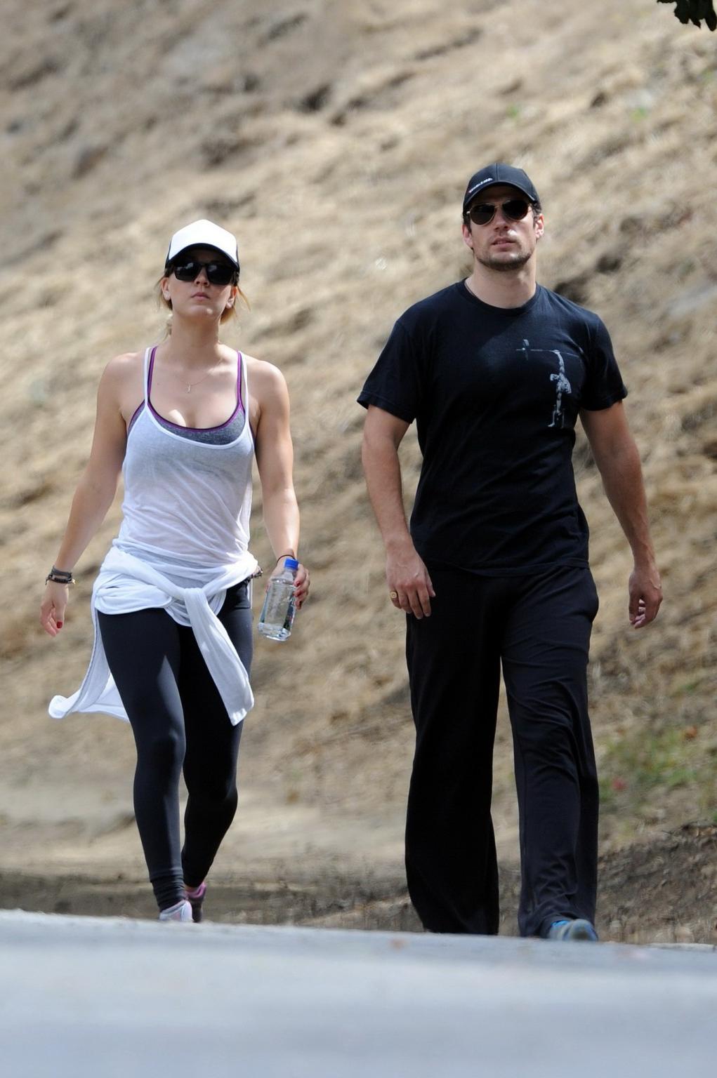16P Kaley Cuoco wearing transparent tank top and tights while hiking on Hollywood Hi