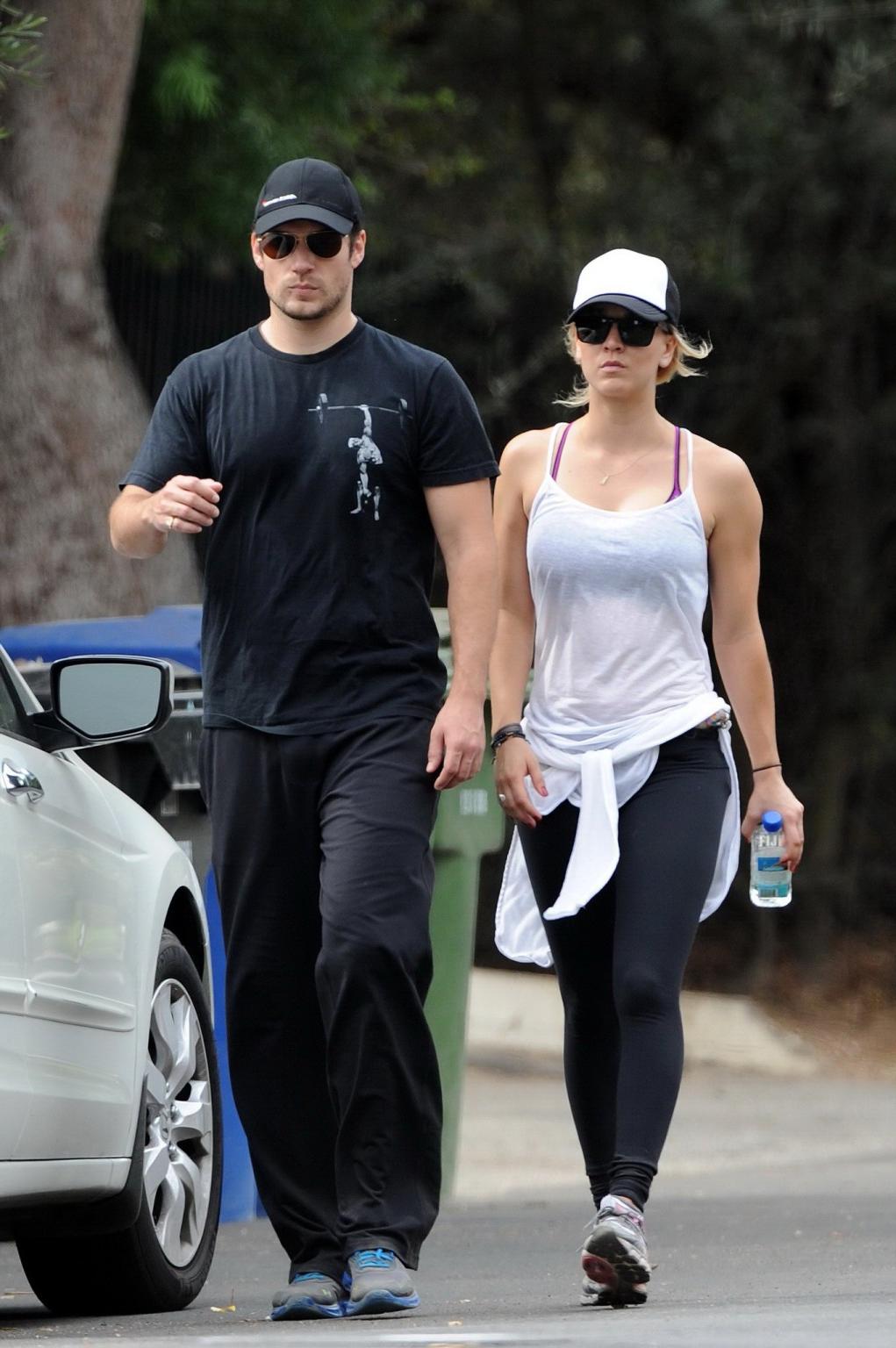 16P Kaley Cuoco wearing transparent tank top and tights while hiking on Hollywood Hi