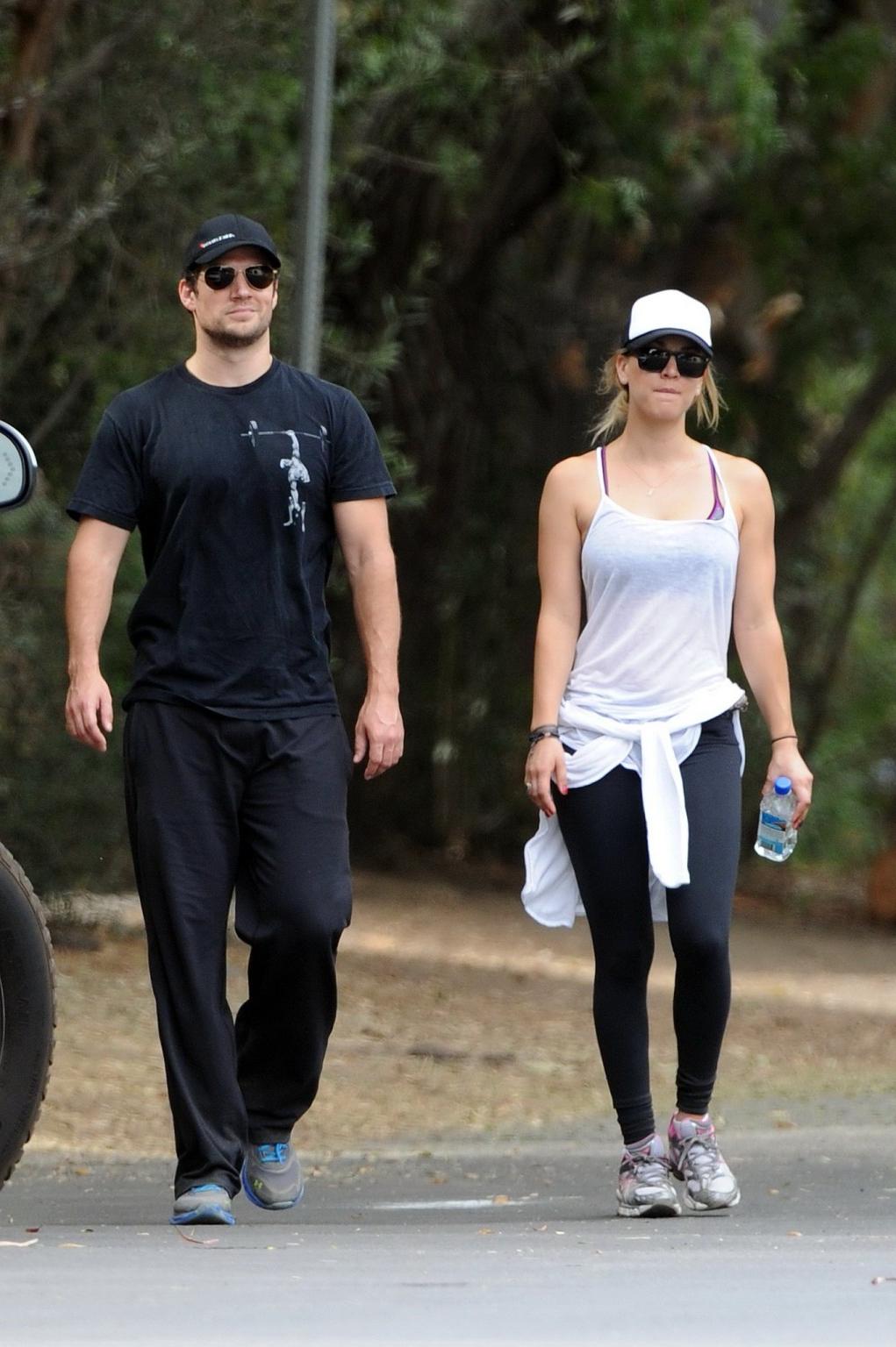 16P Kaley Cuoco wearing transparent tank top and tights while hiking on Hollywood Hi