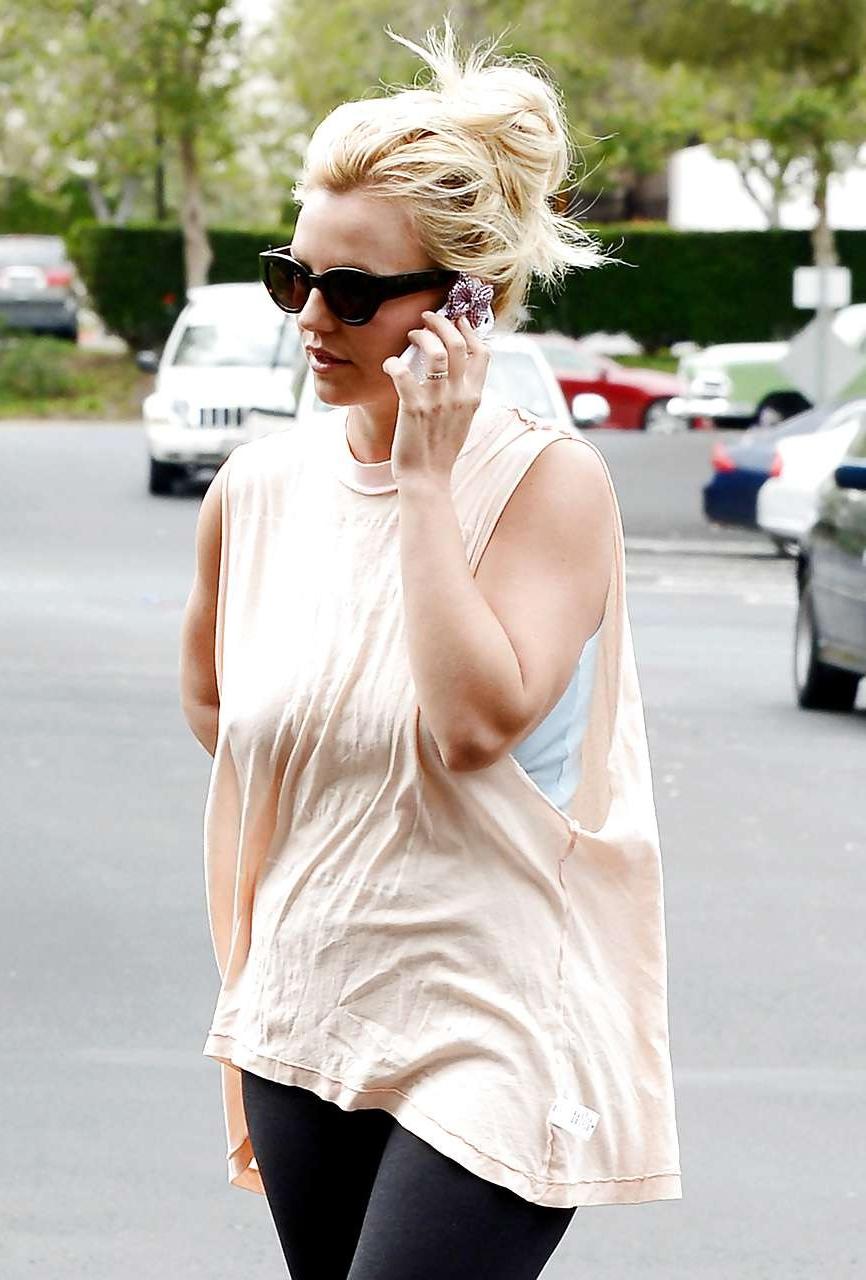 16P Britney Spears showing boobs in see thru shirt on street