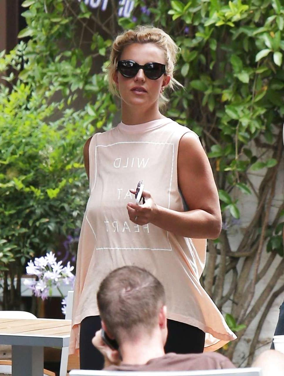 16P Britney Spears showing boobs in see thru shirt on street