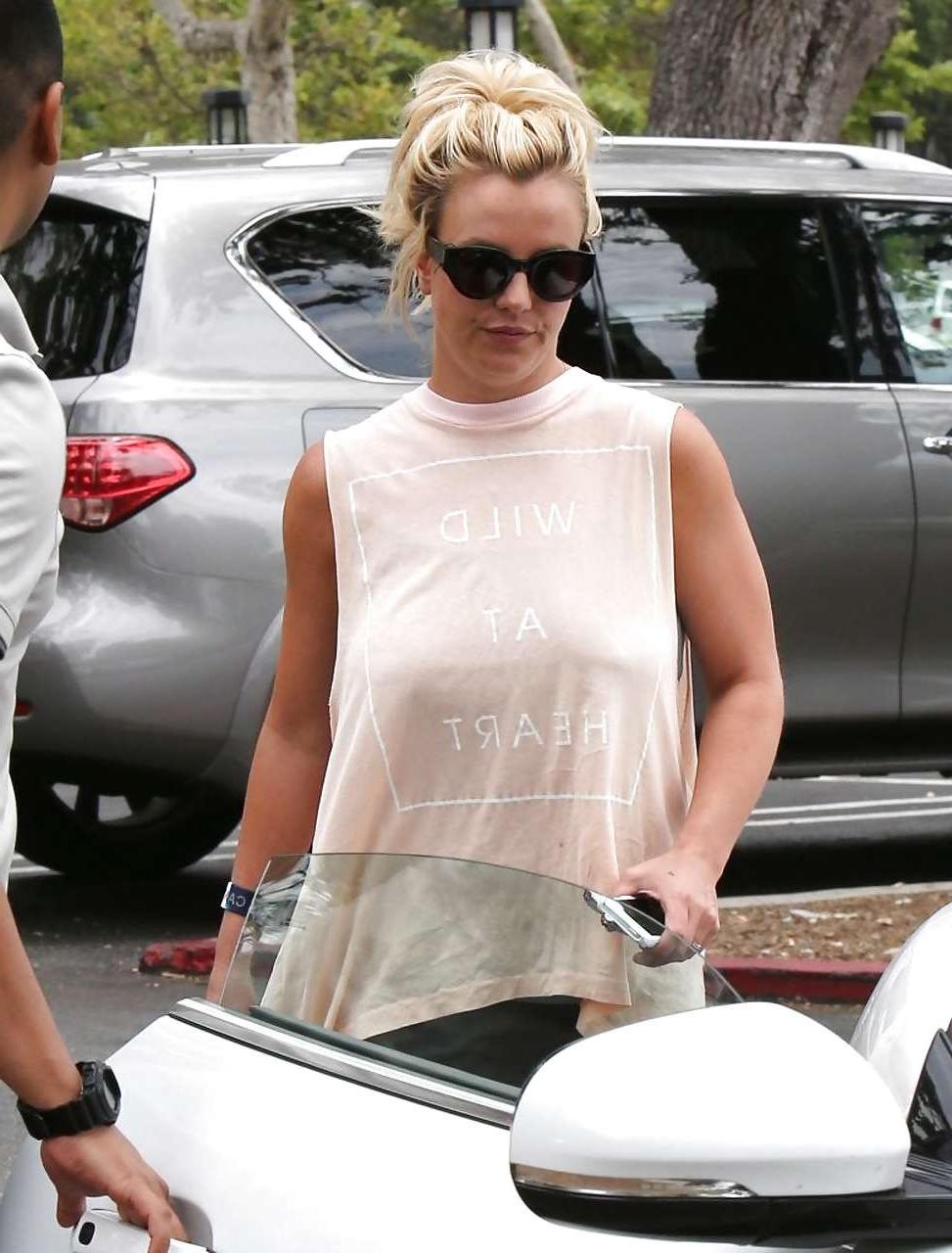 16P Britney Spears showing boobs in see thru shirt on street