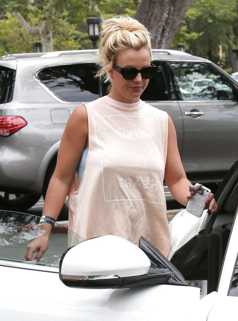 16P Britney Spears showing boobs in see thru shirt on street