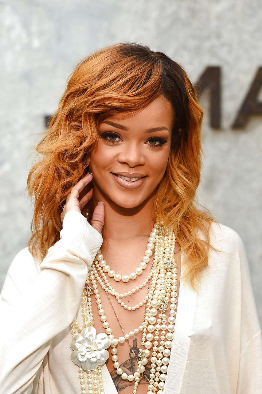 16P Rihanna exposing huge cleavage and long legs in evening dress