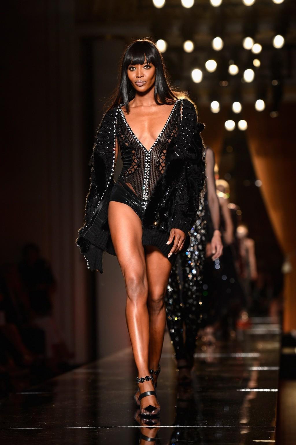 16P Naomi Campbell wearing black transparent lingerie on a catwalk during Versace sh