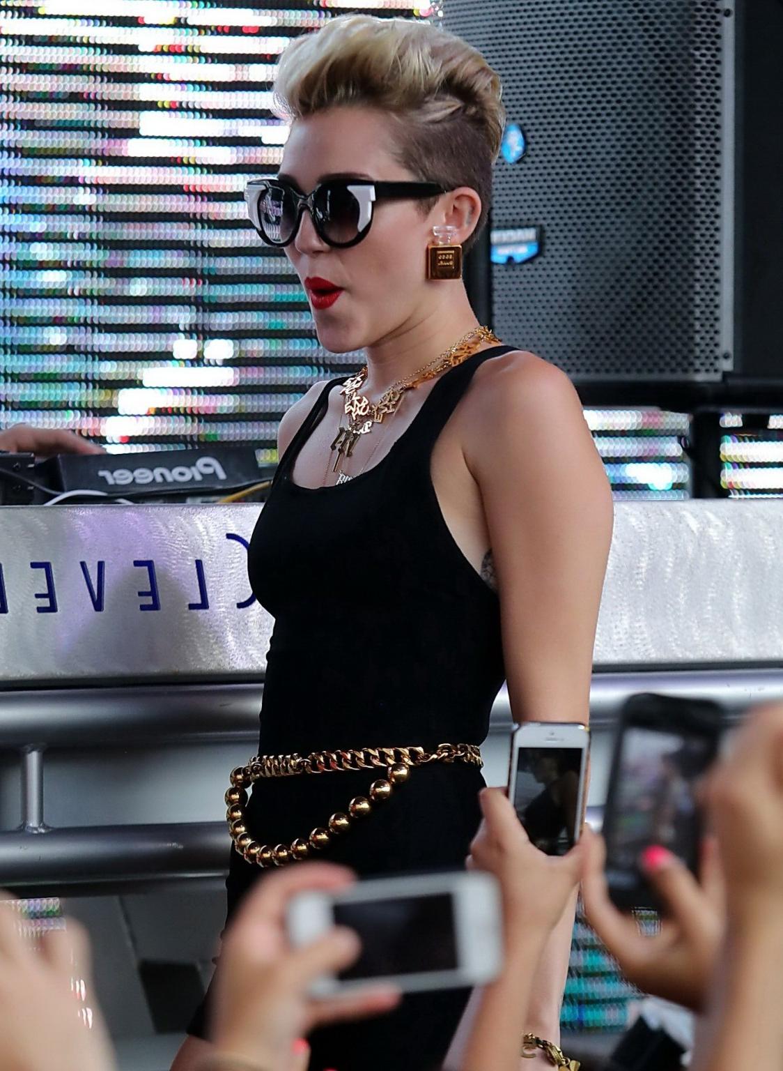 16P Miley Cyrus wearing tight black bodysuit at the Y100 Mack-A-Poolooza pool party 