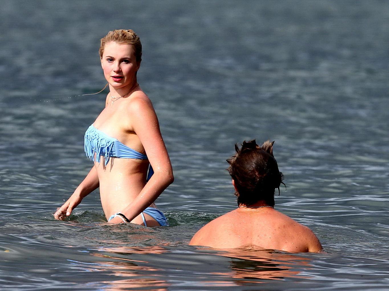 16P Ireland Baldwin nip slip wearing a tube bikini on a Hawaiian beach