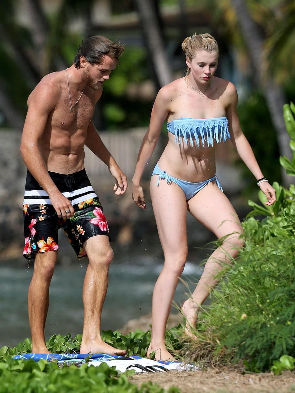 16P Ireland Baldwin nip slip wearing a tube bikini on a Hawaiian beach
