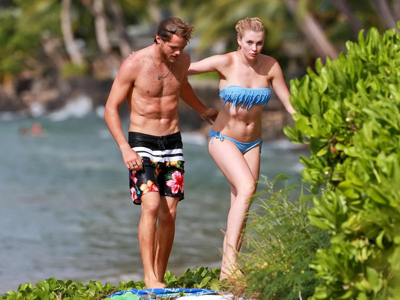 16P Ireland Baldwin nip slip wearing a tube bikini on a Hawaiian beach