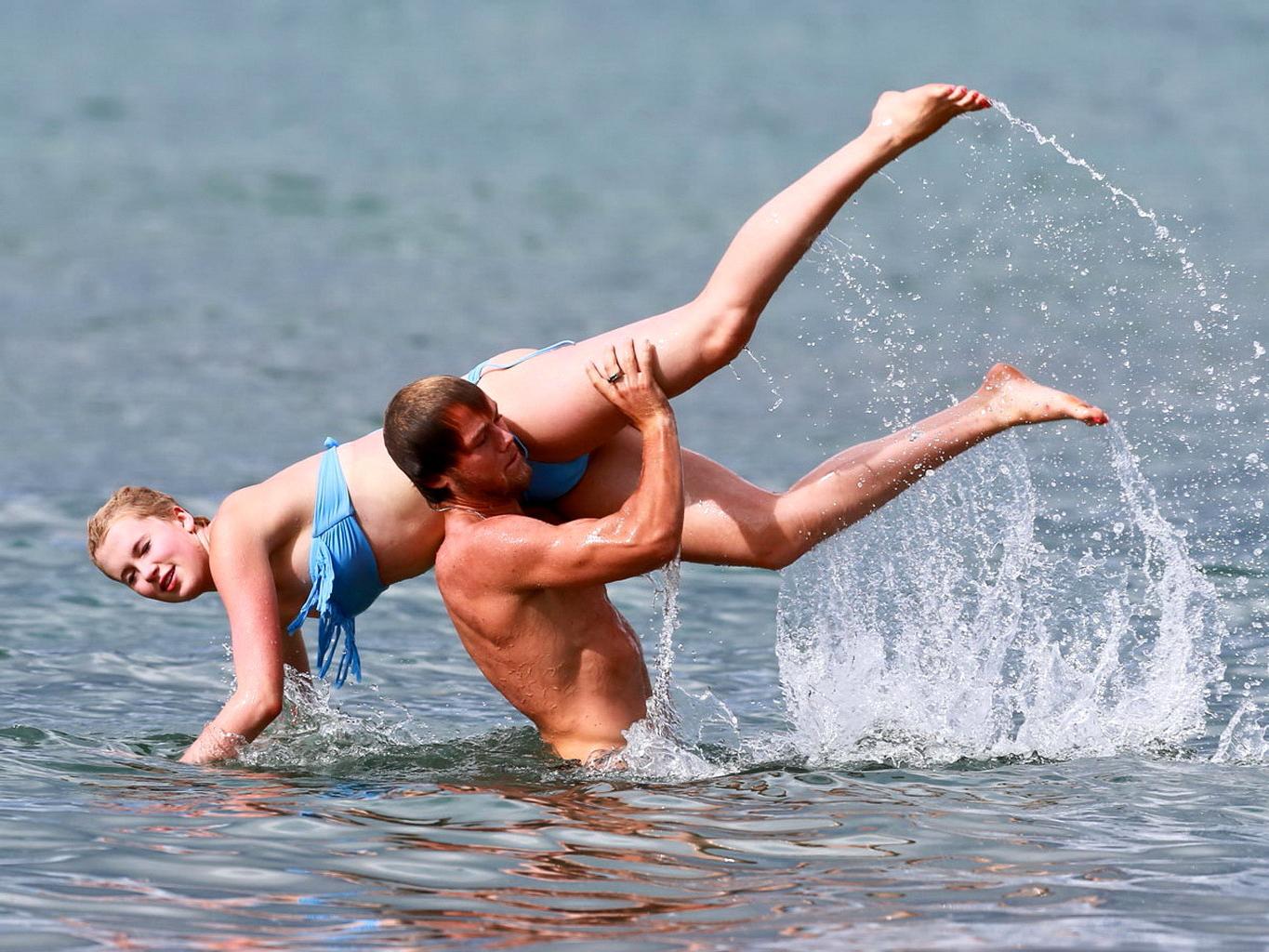16P Ireland Baldwin nip slip wearing a tube bikini on a Hawaiian beach