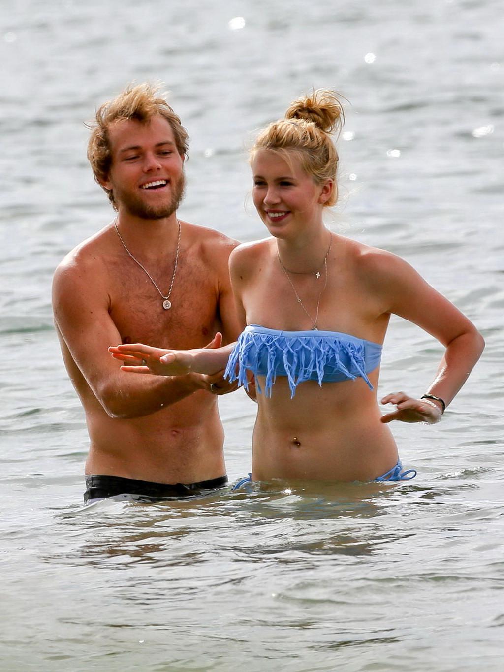 16P Ireland Baldwin nip slip wearing a tube bikini on a Hawaiian beach