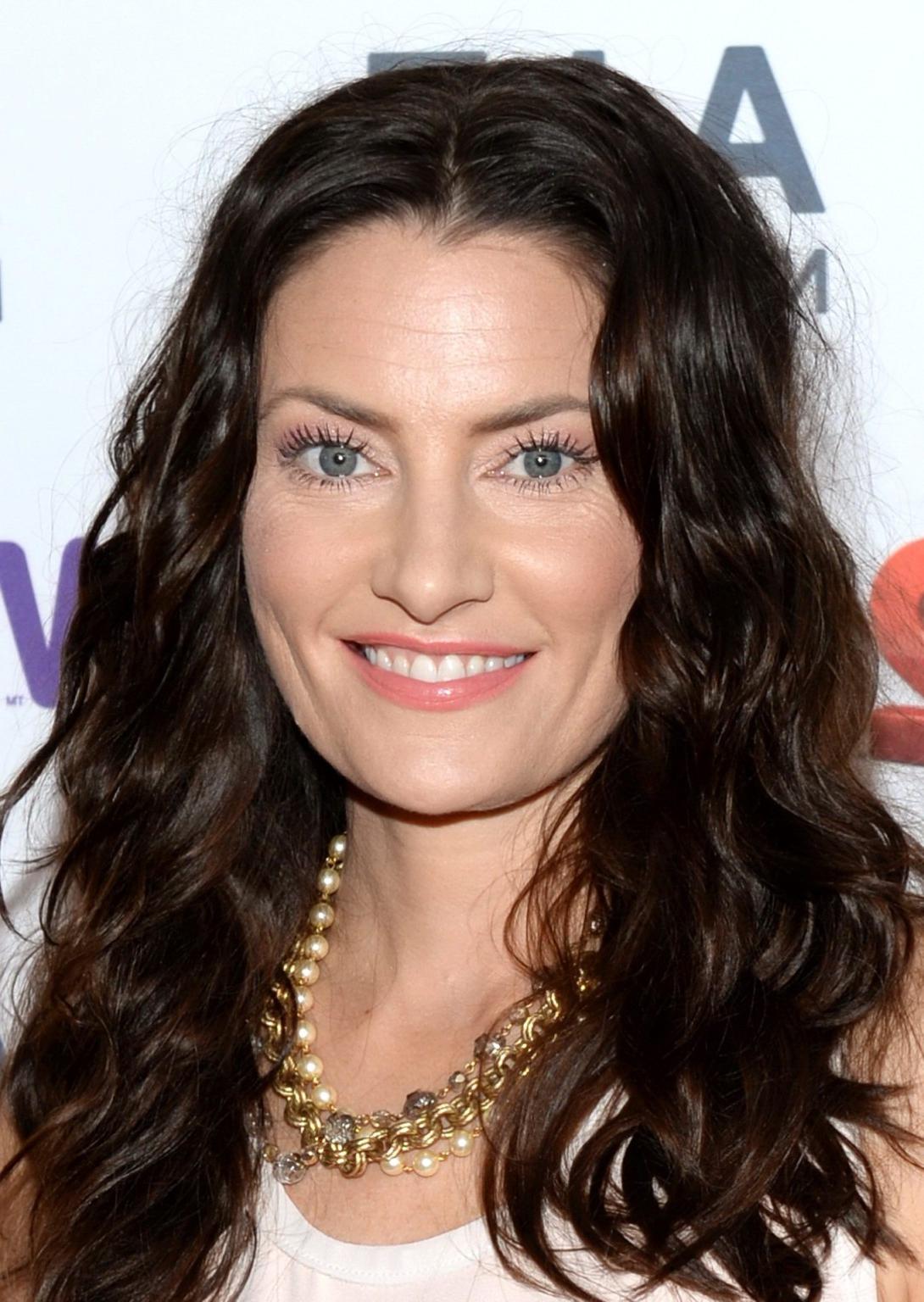 16P Madchen Amick leggy wearing shorts at the  A E Networks Upfront in NYC