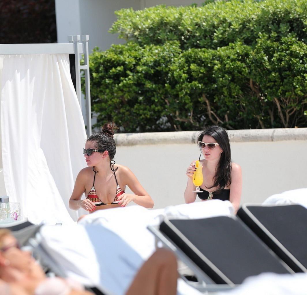 16P Selena Gomez showing off her bikini body poolside in Miami